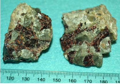 Few crystal faces, but a pretty combination of green chrysoberyl and red almandine garnet from an aluminous pegmatite at Benson Mines.