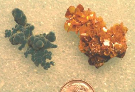 Minerals from Silver Bill Mine, Gleeson, AZ: Wulfenite on the right, rosasite on the left. Rosasite is a copper zinc carbonate (Cu,Zn)2(CO3)(OH)2 which forms velvety connected balls.