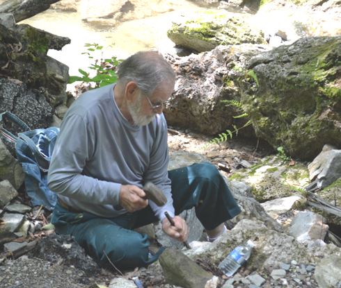 Ken Rowe continues to collect with the WCGMC. Here he is chiseling out a travertine piece on our June 26th trip to Ilion Gorge.