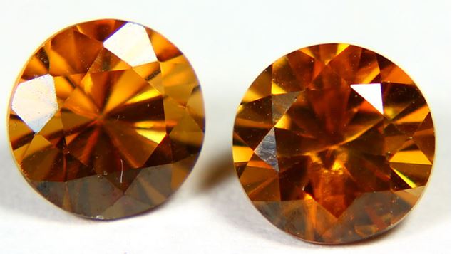 Hyacinth is a name often used in conjunction with gem quality yellow of brown red zircon such as this pair of 3.4 ct round cut gems from Cambodia.