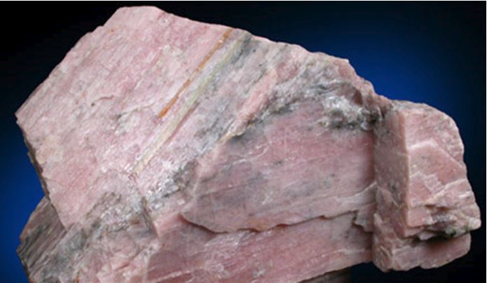 Pink bustamite, with willemite, from the Franklin, NJ  (from online mineral museum of John Betts) 